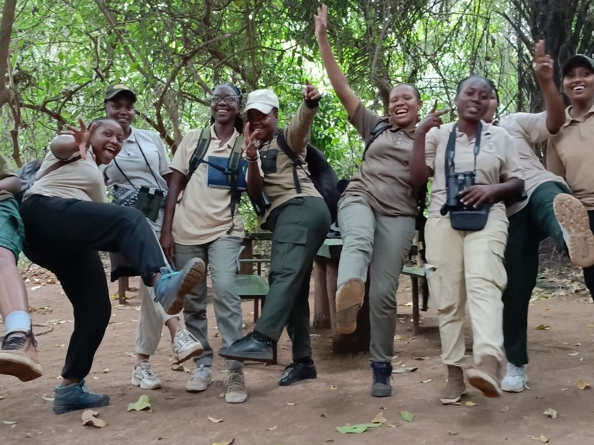 Young women birding in forest